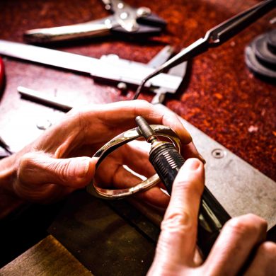 Rowena polishing a forged silver bangle