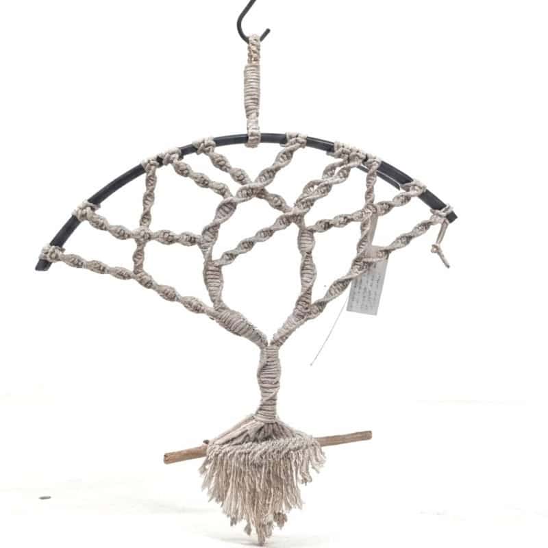 Macrame tree of Life wine barrel handcrafted macramé tree of life brings a soft, natural elegance to any room. Made from creamy cotton cord, each branch is carefully knotted within a half‑circle metal frame and anchored to a piece of hand‑selected driftwood. The flowing fringe adds gentle movement, making it a perfect accent for coastal, boho, or minimalist interiors.