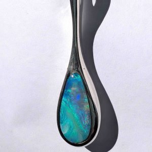 This elegant pendant features a solid Australian opal, hand‑cut and set in sterling silver by Perth jeweller Roger Withers.