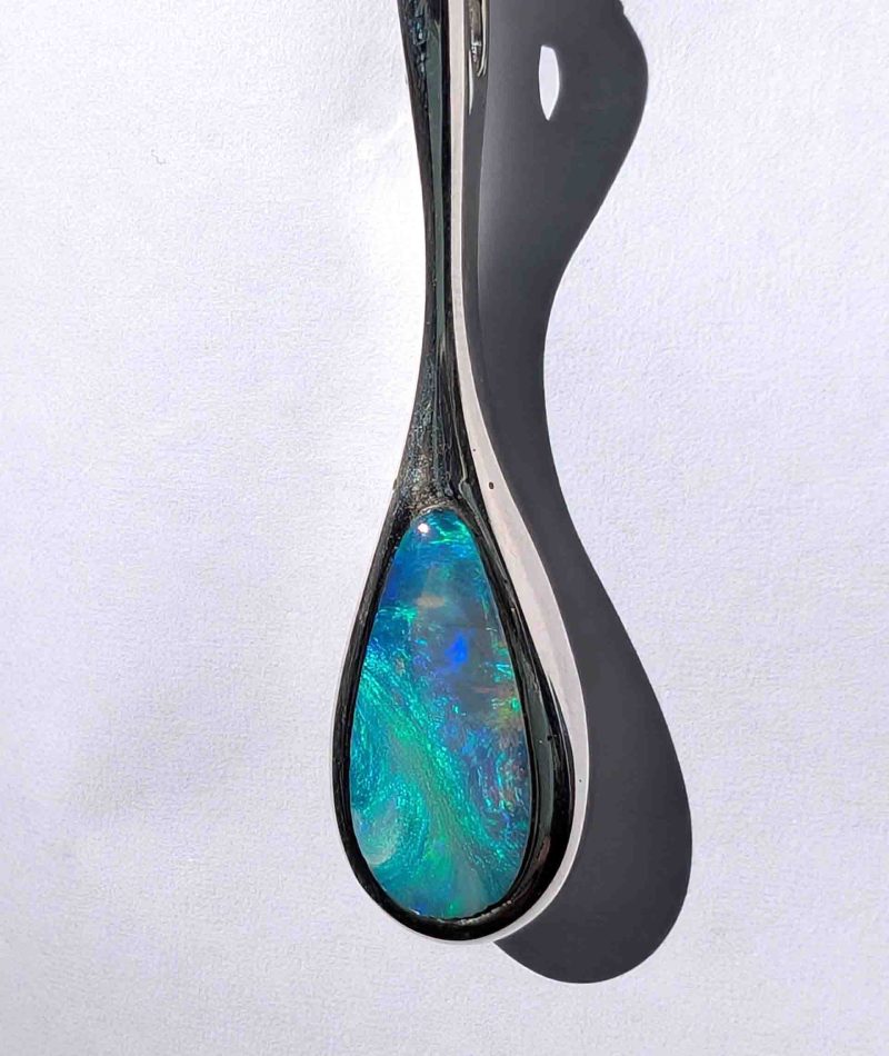 This elegant pendant features a solid Australian opal, hand‑cut and set in sterling silver by Perth jeweller Roger Withers.
