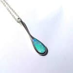 This elegant pendant features a solid Australian opal, hand‑cut and set in sterling silver by Perth jeweller Roger Withers.
