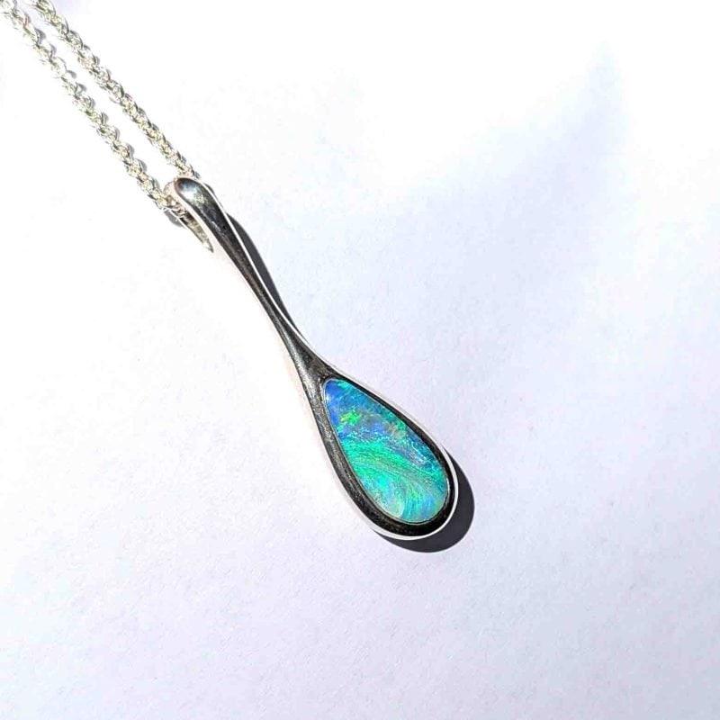 This elegant pendant features a solid Australian opal, hand‑cut and set in sterling silver by Perth jeweller Roger Withers.