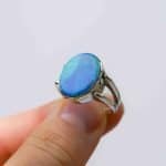 Australian Solid opal ring, oval shaped sterling silver band on a fore finger handcrafted by Roger Withers