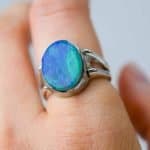 Australian Solid opal ring, oval shaped sterling silver band on a fore finger handcrafted by Roger Withers