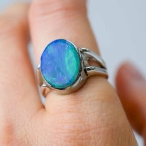 Australian Solid opal ring, oval shaped sterling silver band on a fore finger handcrafted by Roger Withers