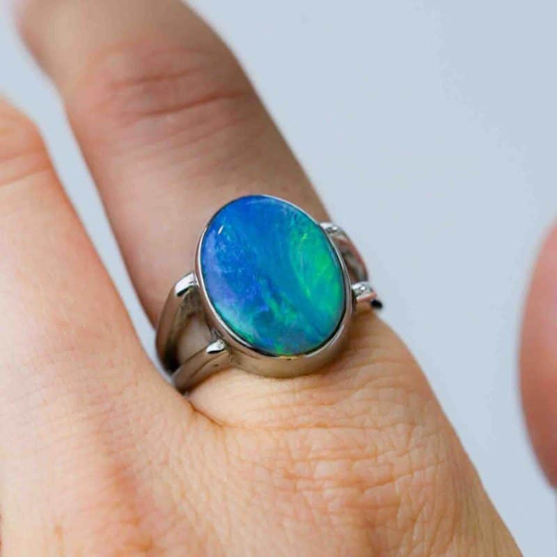 Australian Solid opal ring, oval shaped sterling silver band on a fore finger handcrafted by Roger Withers