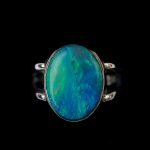 Australian Solid opal ring, oval shaped sterling silver band on a fore finger handcrafted by Roger Withers