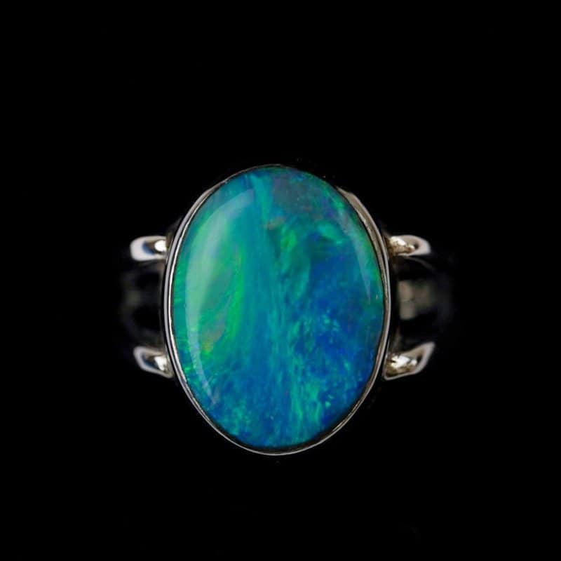 Australian Solid opal ring, oval shaped sterling silver band on a fore finger handcrafted by Roger Withers