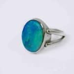 Australian Solid opal ring, oval shaped sterling silver band on a fore finger handcrafted by Roger Withers