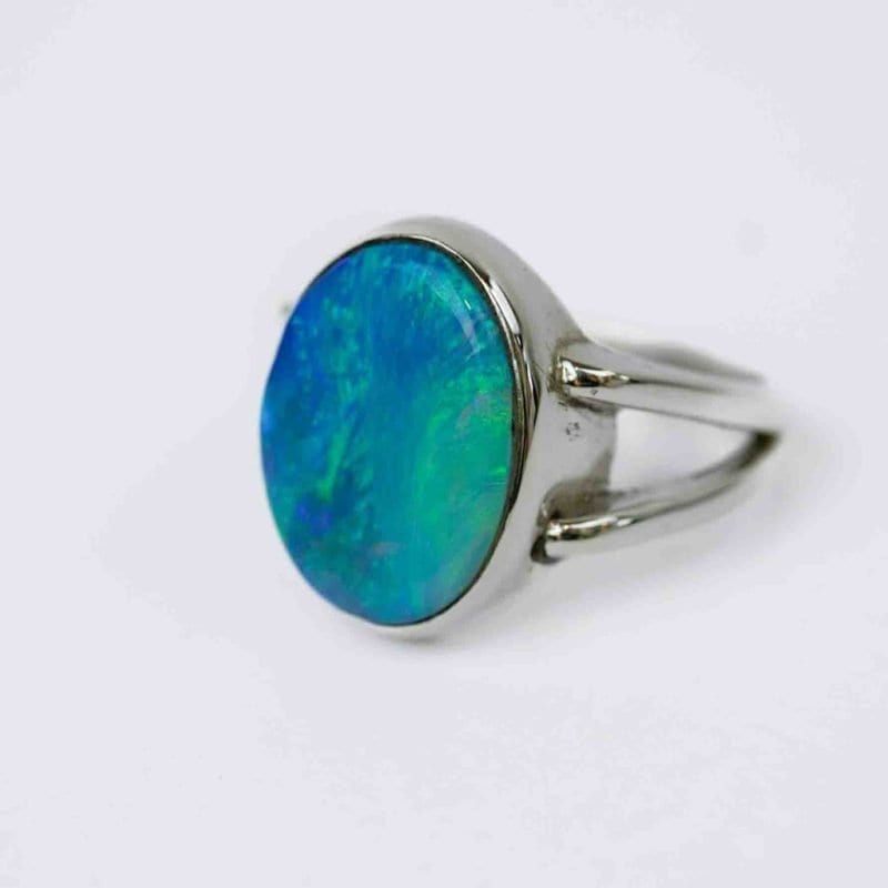 Australian Solid opal ring, oval shaped sterling silver band on a fore finger handcrafted by Roger Withers