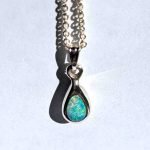 Pear shaped solid opal and chain showing beautiful play of colour handcrafted by Roger Withers