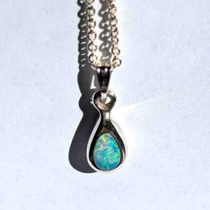Pear shaped solid opal and chain showing beautiful play of colour handcrafted by Roger Withers