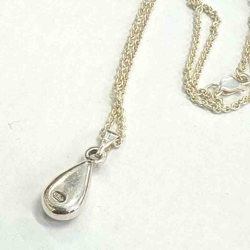 back view of the STerling silver bezel surrounds to pear shaped opal .925 stamp by Roger Withers
