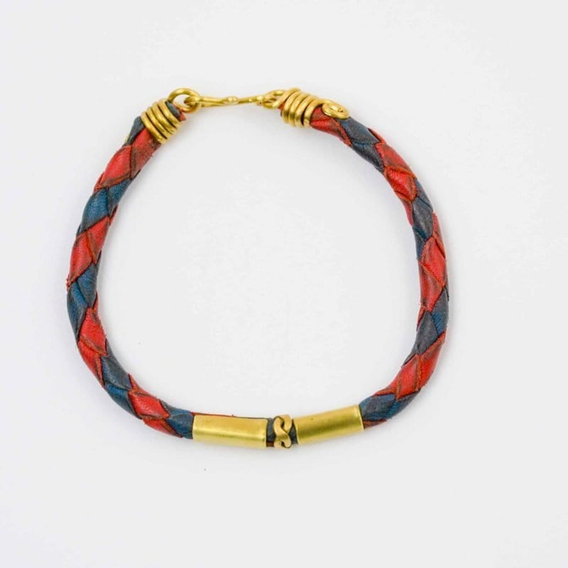 Leather Woven Jewellery. A red and navy blue braided leather bracelet with antique brass fittings and a hook clasp. Hand made by Western Australian Artisan Oswaldo Paz
