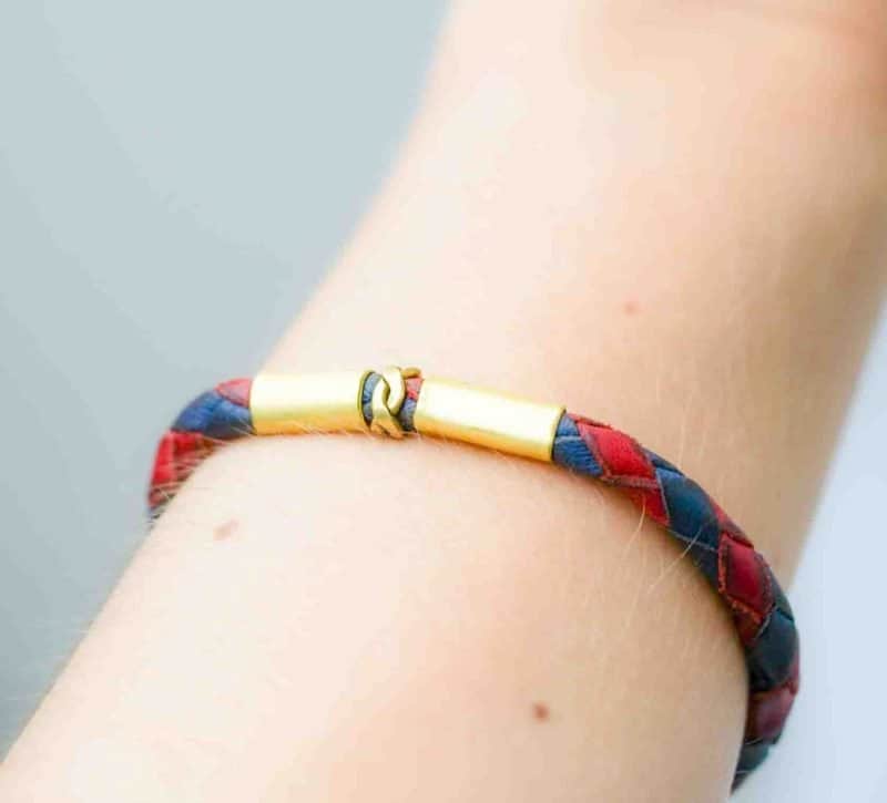 red and blue woven leather bracelet (4) Oswaldo Paz. Western Australian Artist. Leather Woven Jewellery. A red and navy blue braided leather bracelet with antique brass fittings and a hook clasp.