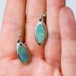 opals in a bezel setting made of sterling silver with sheppard hook attachments