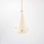 white porcolen star bell a conical white porcelain bell with four small stars cut from the bottom of the bell with the inside of the cut line painted red