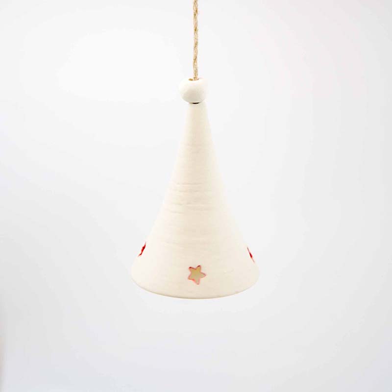 white porcolen star bell a conical white porcelain bell with four small stars cut from the bottom of the bell with the inside of the cut line painted red