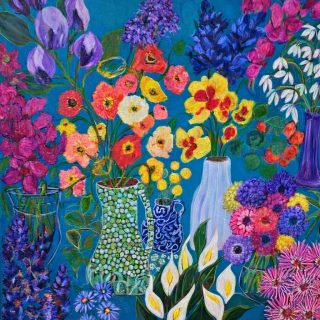A vivid painting of assorted flowers arranged in decorative vases against a rich blue background. The composition includes bright poppies in red, orange, yellow, and white; purple irises; white calla lilies; and clusters of pink, violet, and blue blossoms. Each vase has a unique design—green mosaic, blue patterned, and solid purple or white—adding texture and contrast. The overall effect is lush and celebratory, showcasing a diverse mix of blooms in a lively, colorful display.