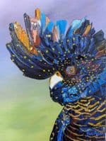 An expressive oil painting of a black cockatoo titled “Keeping an Eye on You.” The bird’s profile is shown in vivid detail, with thick, textured palette‑knife strokes in deep blues, oranges, and golds. Bright yellow dots accent its feathers, and its intense orange eye stands out against a softly blended lavender and green background. The artwork captures the intelligence and watchful presence of Australia’s native wildlife, signed Sue Adams in the lower right corner.