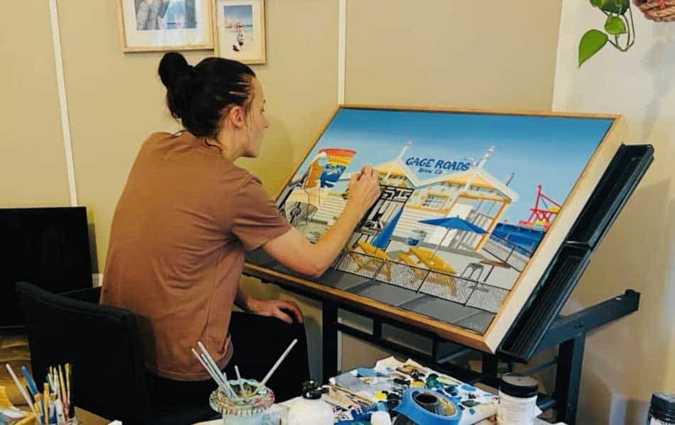 Laura Farnhill in her studio painting Gage Roads