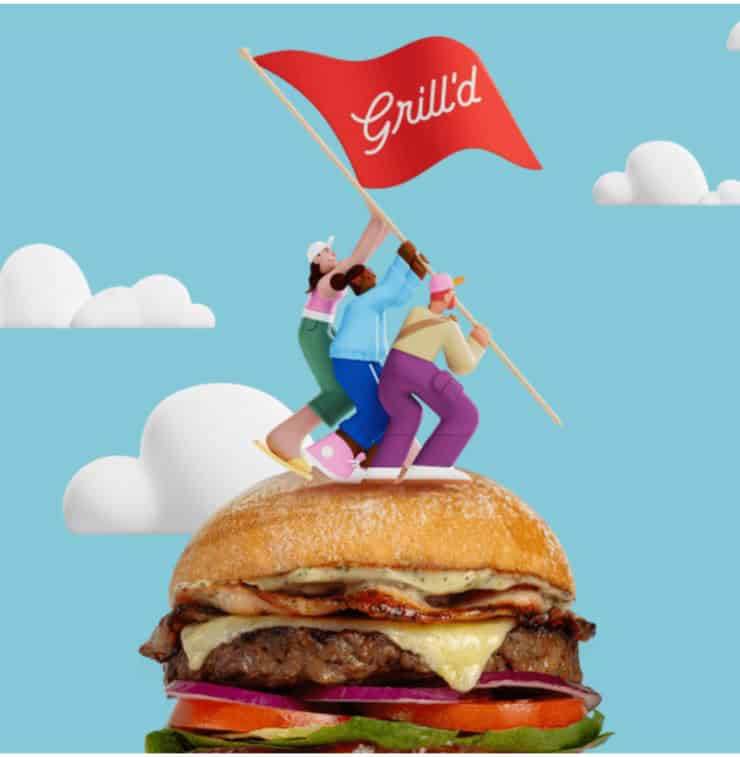 A playful illustration featuring a large burger topped with cartoon-style figures raising a red flag that reads “Grill’d.” The burger includes layers of lettuce, tomato, red onion, melted cheese, bacon, and a beef patty inside a golden bun. The background is bright blue with fluffy white clouds, creating a cheerful and imaginative scene that symbolizes teamwork and pride in the Grill’d brand.