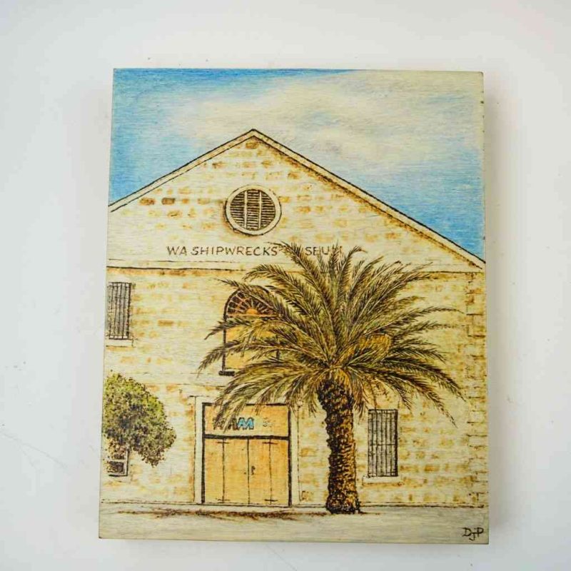 The image shows the WA Shipreweck Museum pyrography print from a slightly side-on angle