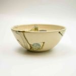 Abstract Ceramic Bowl Conch Shell Magda (1) Ceramic bowl with a white base and abstract paint . Tje anstract paint pictured resembles a stingray