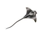 The metal eagle ray is flipped to show it's underside, revealing that it is a bottle opener