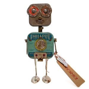Robot sculpture made from vintage tins and metal parts with a smiling face